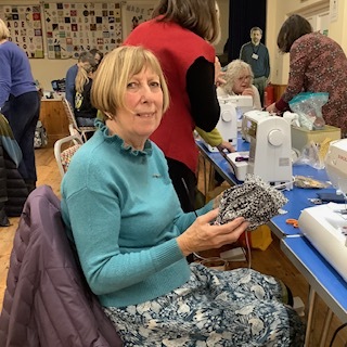 Ann showing the ohmiyage  bag she is making in Evelyn’s workshop